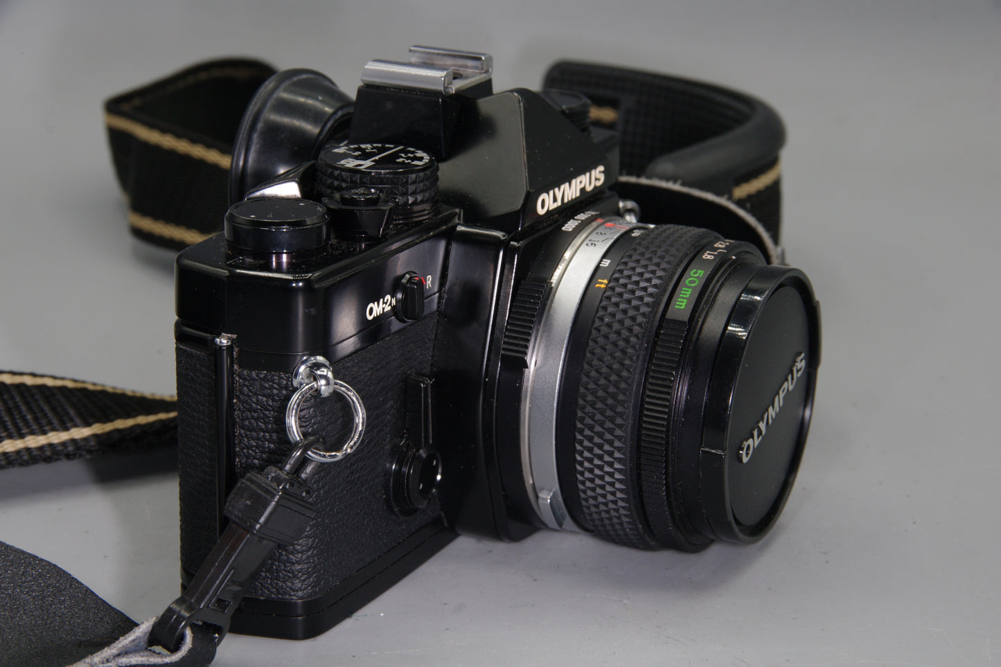 Olympus OM-2N Black 35mm SLR + Zuiko 50mm f/1.8 Lens – Tested & New Batteries