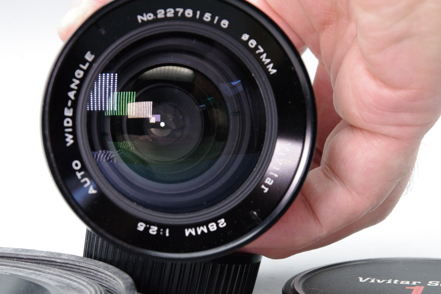 Vivitar 28mm f/2.5 Wide Angle Lens – OM Mount – Very Good – Caps & Hoya Hood