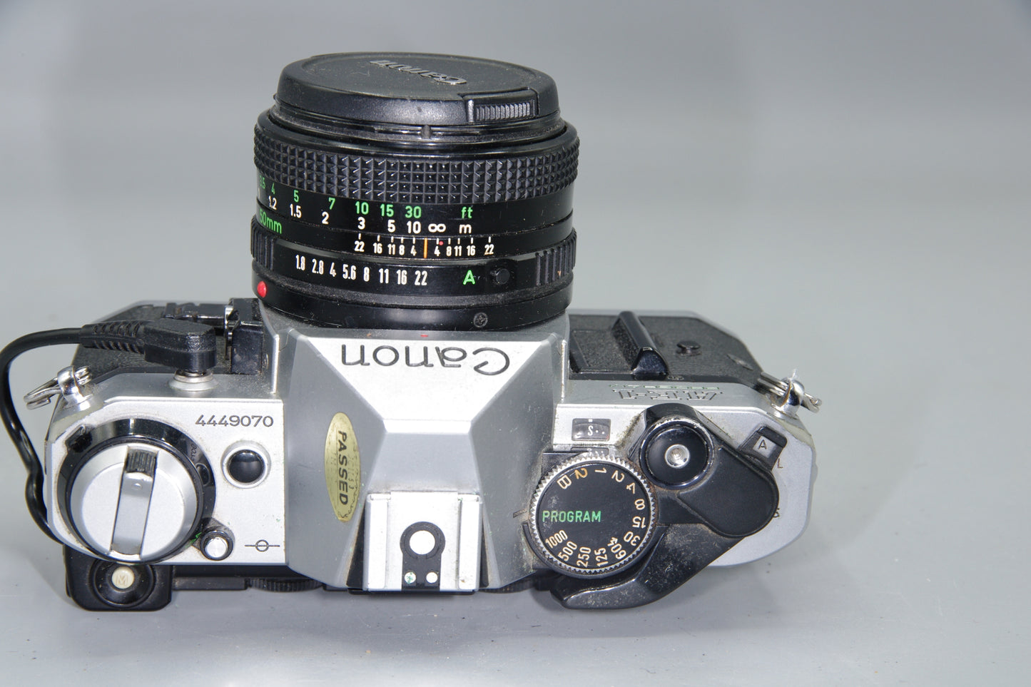 Canon AE‑1 Program 35mm SLR + FD 50mm f/1.8 Lens + Data Back A