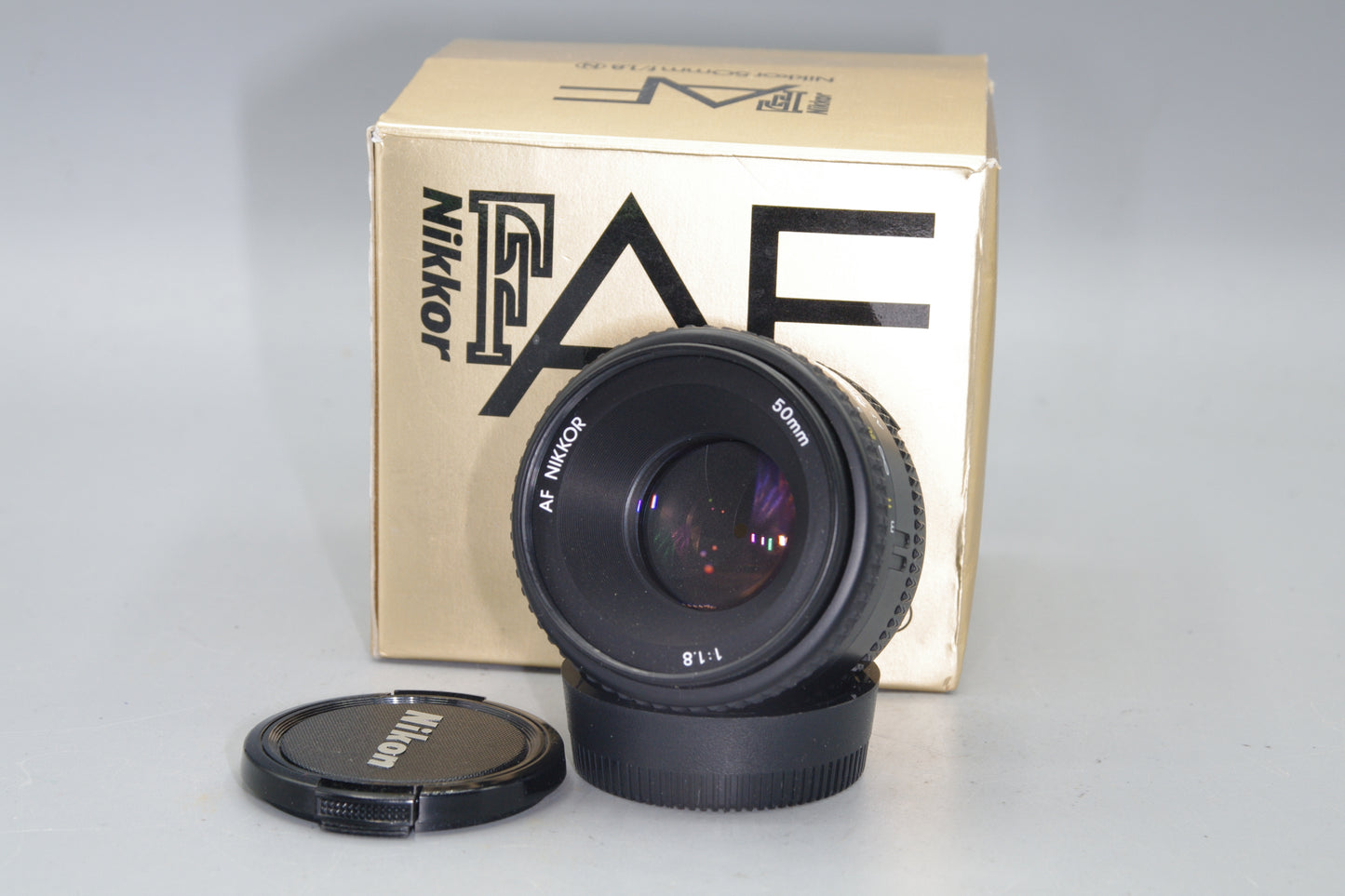 Nikon AF Nikkor 50mm F/1.8 Lens - with both caps and box - Excellent