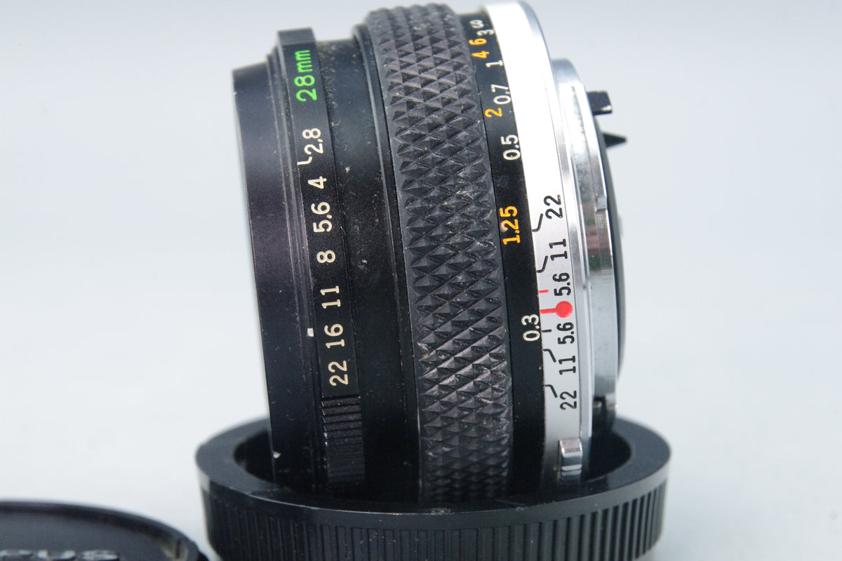 Olympus Zuiko Auto‑W 28mm f/2.8 – OM Mount – Minor Front Element Scratches