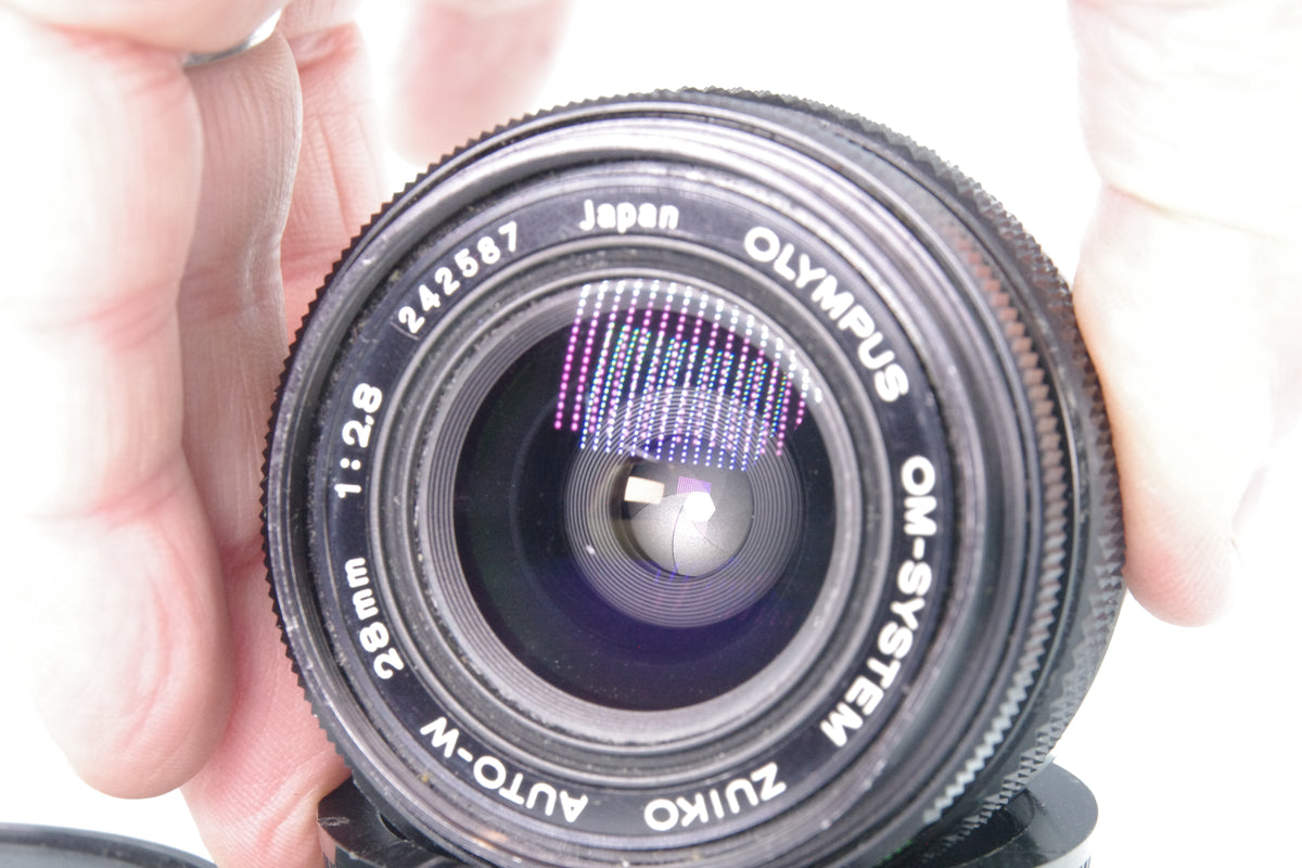 Olympus Zuiko Auto‑W 28mm f/2.8 – OM Mount – Minor Front Element Scratches