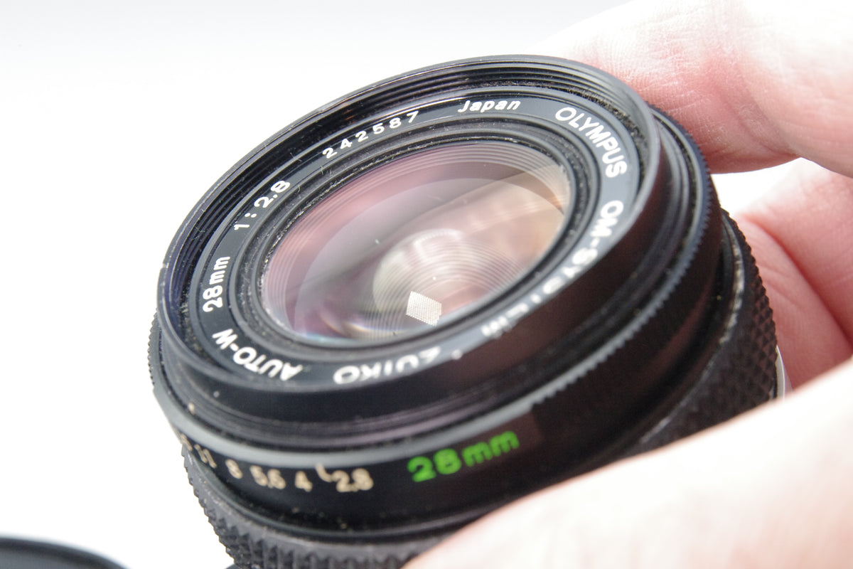 Olympus Zuiko Auto‑W 28mm f/2.8 – OM Mount – Minor Front Element Scratches