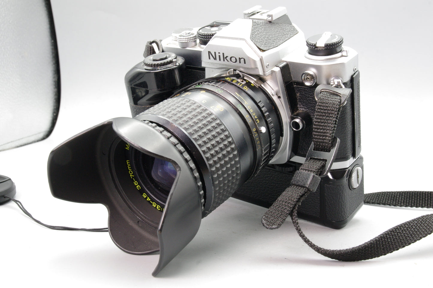 Nikon FM + MD‑12 Motor Drive + Bell & Howell 35‑70mm Lens – Tested – Very Good