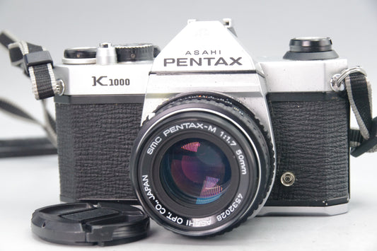 Pentax K1000 35mm SLR + SMC Pentax-M 50mm f/1.7 Lens – Very Good