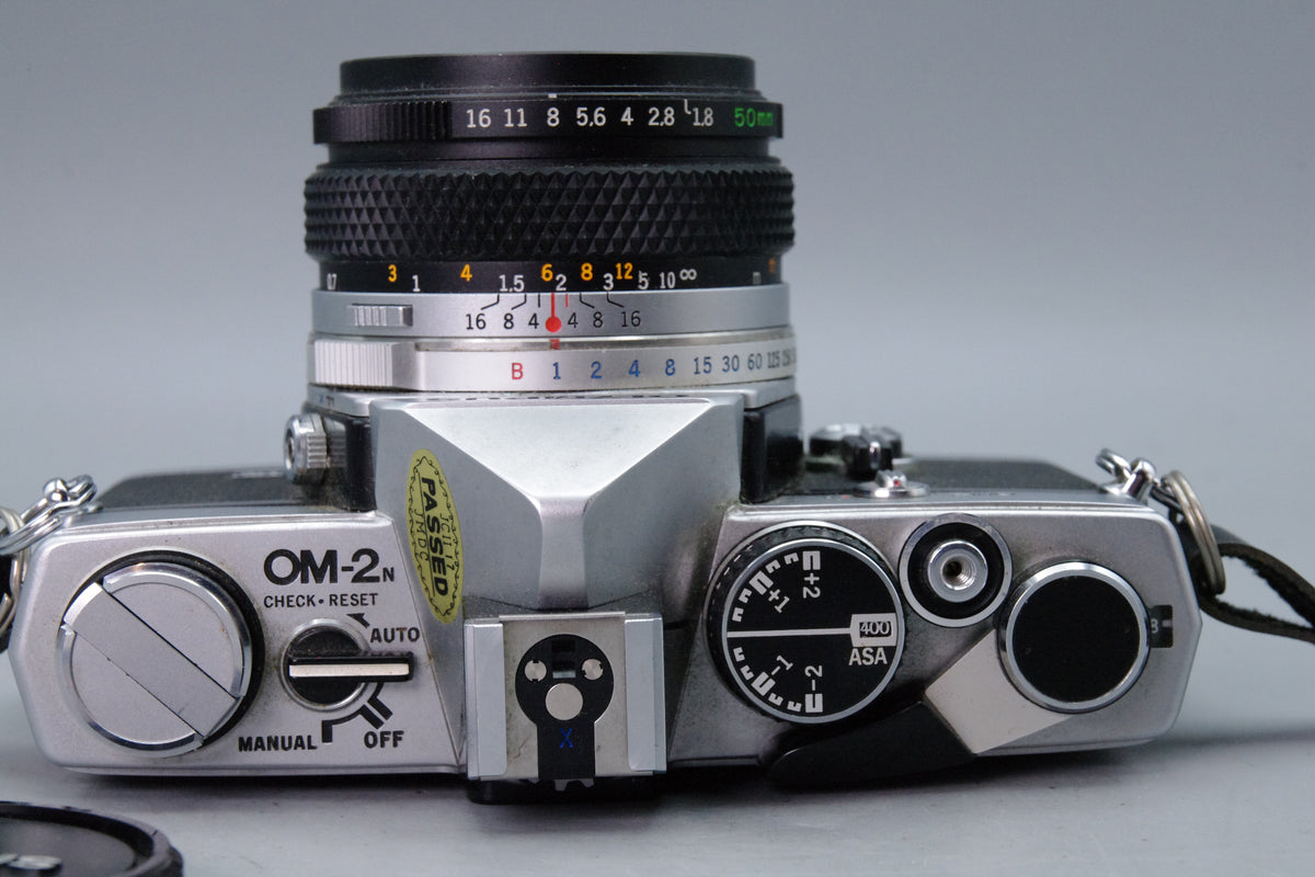 Olympus OM-2N 35mm SLR + Zuiko 50mm f/1.8 Lens – Tested & New Batteries