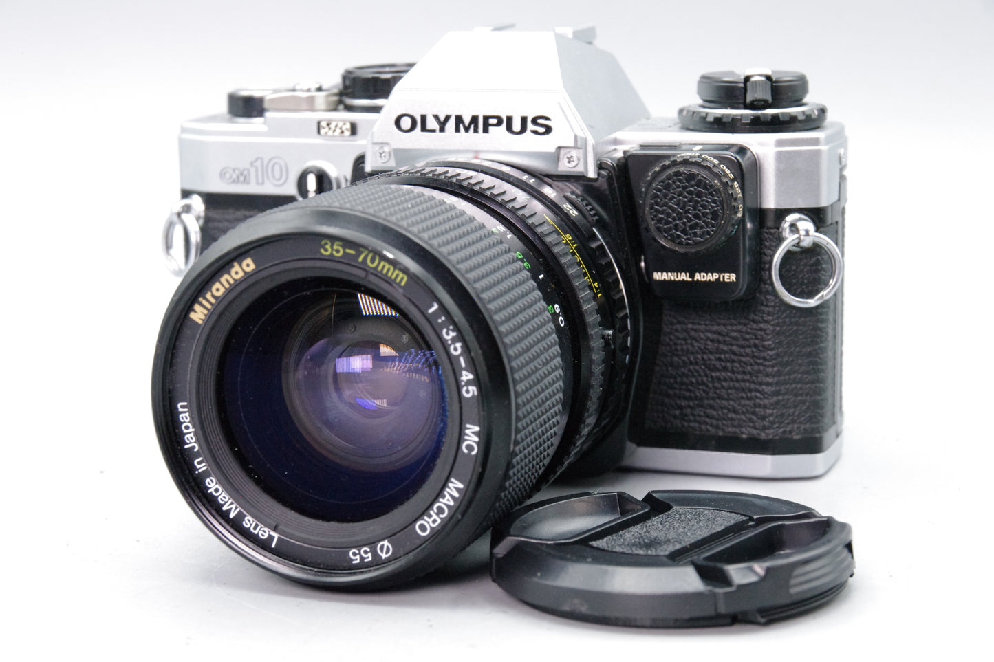 Olympus OM10 35mm SLR Camera + Miranda 35–70mm Lens + Manual Adapter + Batteries