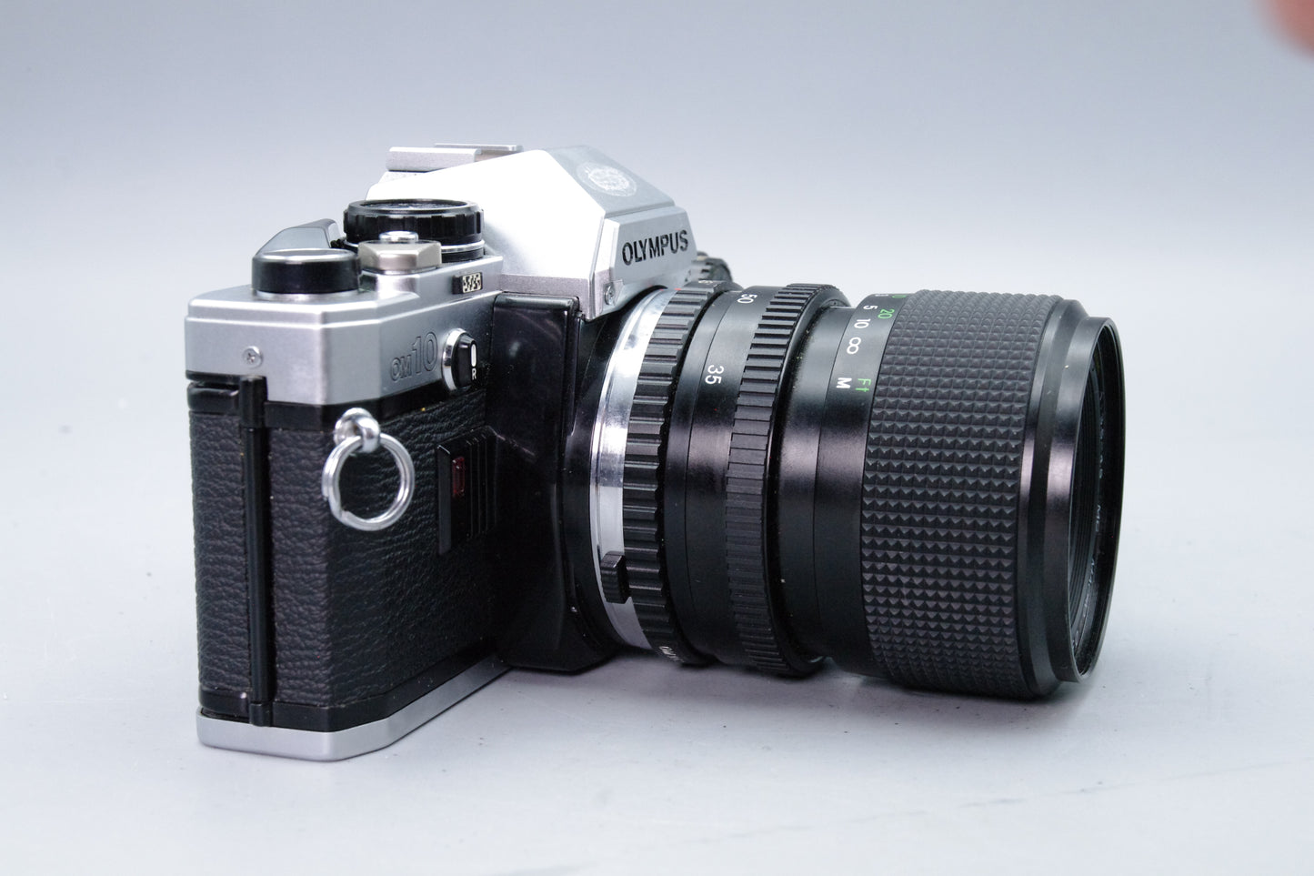 Olympus OM10 35mm SLR Camera + Miranda 35–70mm Lens + Manual Adapter + Batteries
