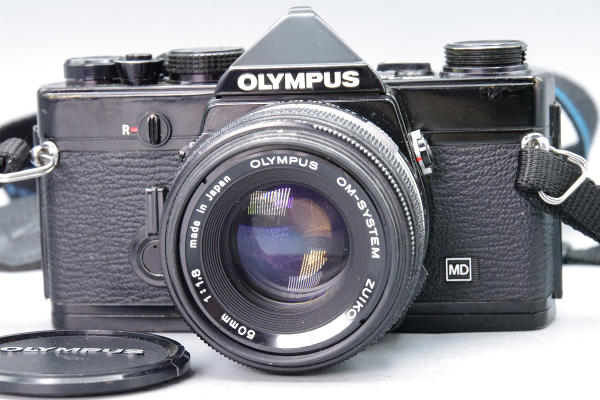 Olympus OM‑1N Black 35mm SLR Film Camera with Zuiko 50mm f/1.8 Lens – VGC