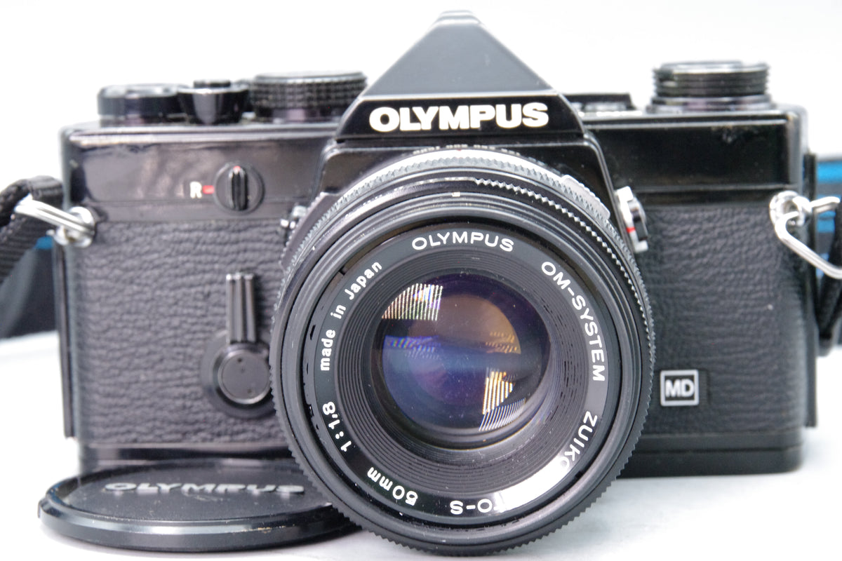Olympus OM‑1N Black 35mm SLR Film Camera with Zuiko 50mm f/1.8 Lens – VGC