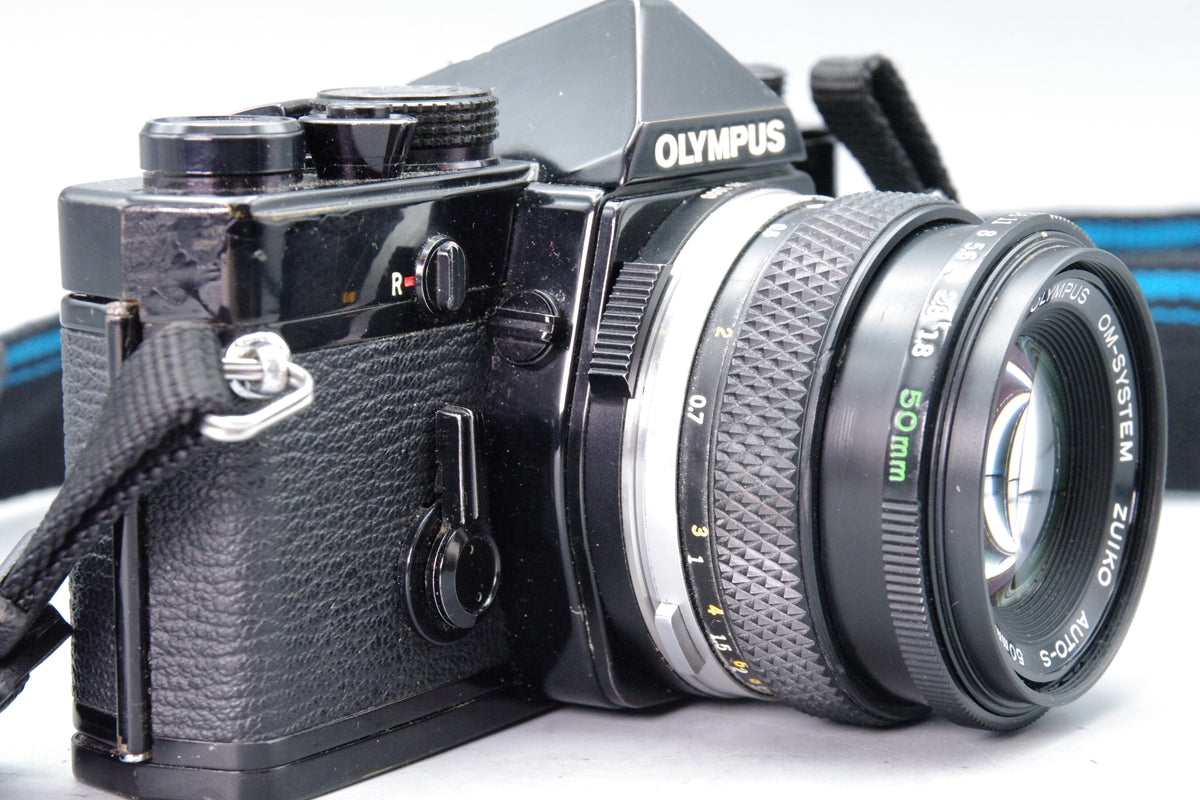 Olympus OM‑1N Black 35mm SLR Film Camera with Zuiko 50mm f/1.8 Lens – VGC