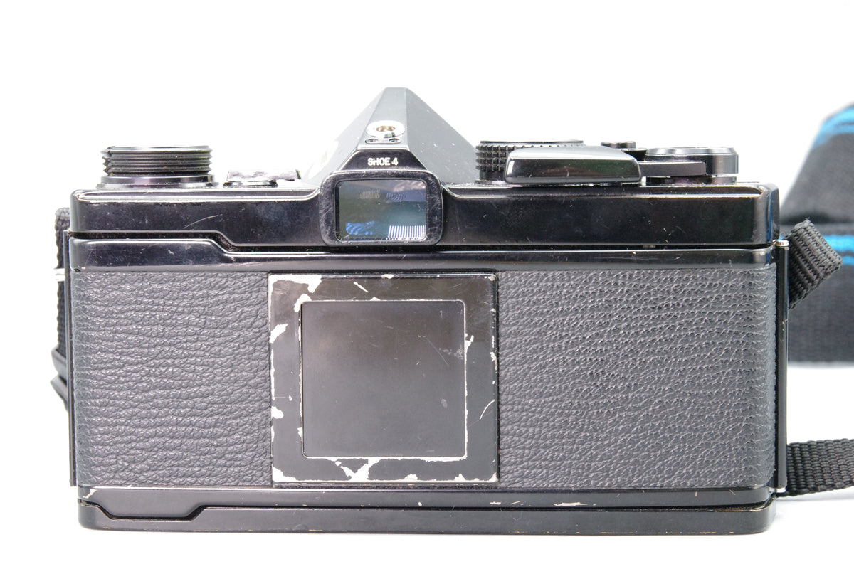 Olympus OM‑1N Black 35mm SLR Film Camera with Zuiko 50mm f/1.8 Lens – VGC