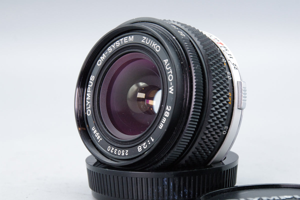 Olympus Zuiko Auto-W 28mm f/2.8 Wide Angle Lens – OM Mount – Excellent