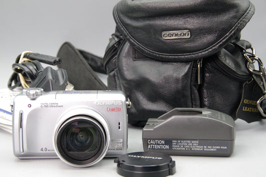 Olympus Camedia C‑795 Digital Camera with Case, Charger, Instructions