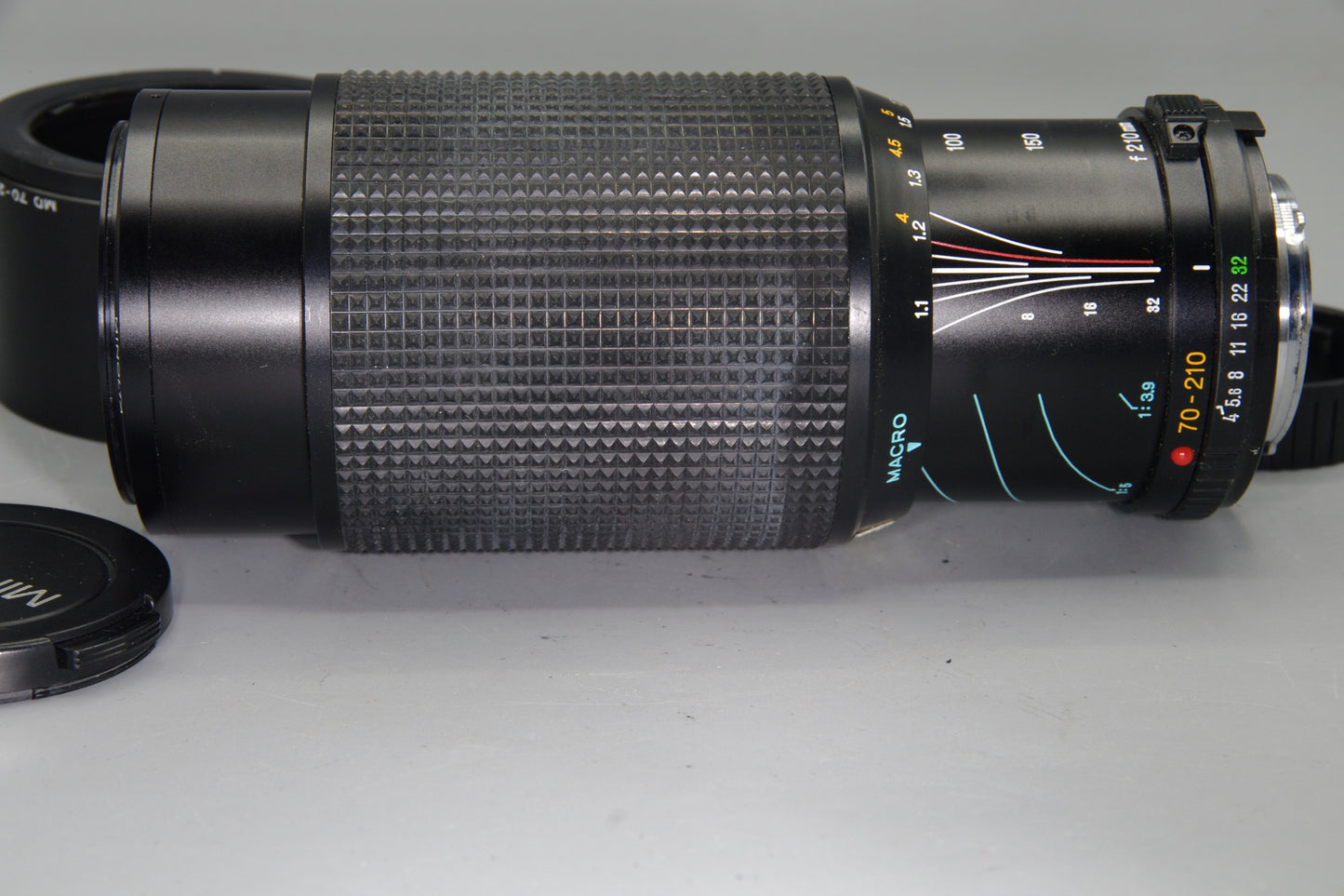 Minolta MD Zoom 70–210mm f/4 Lens – Very Good Condition with Hood