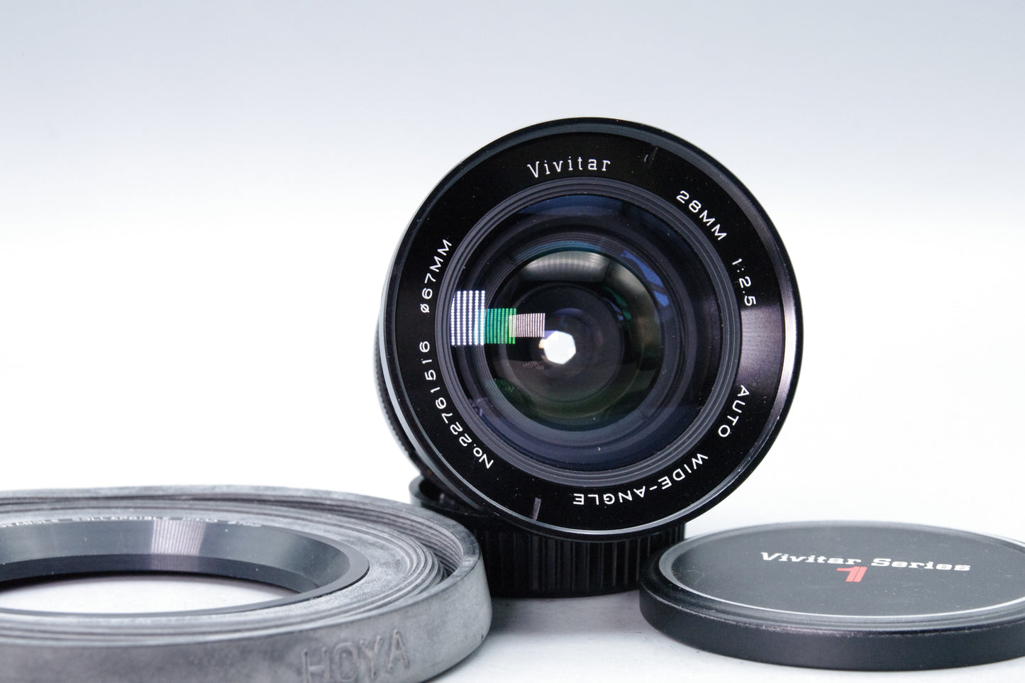 Vivitar 28mm f/2.5 Wide Angle Lens – OM Mount – Very Good – Caps & Hoya Hood