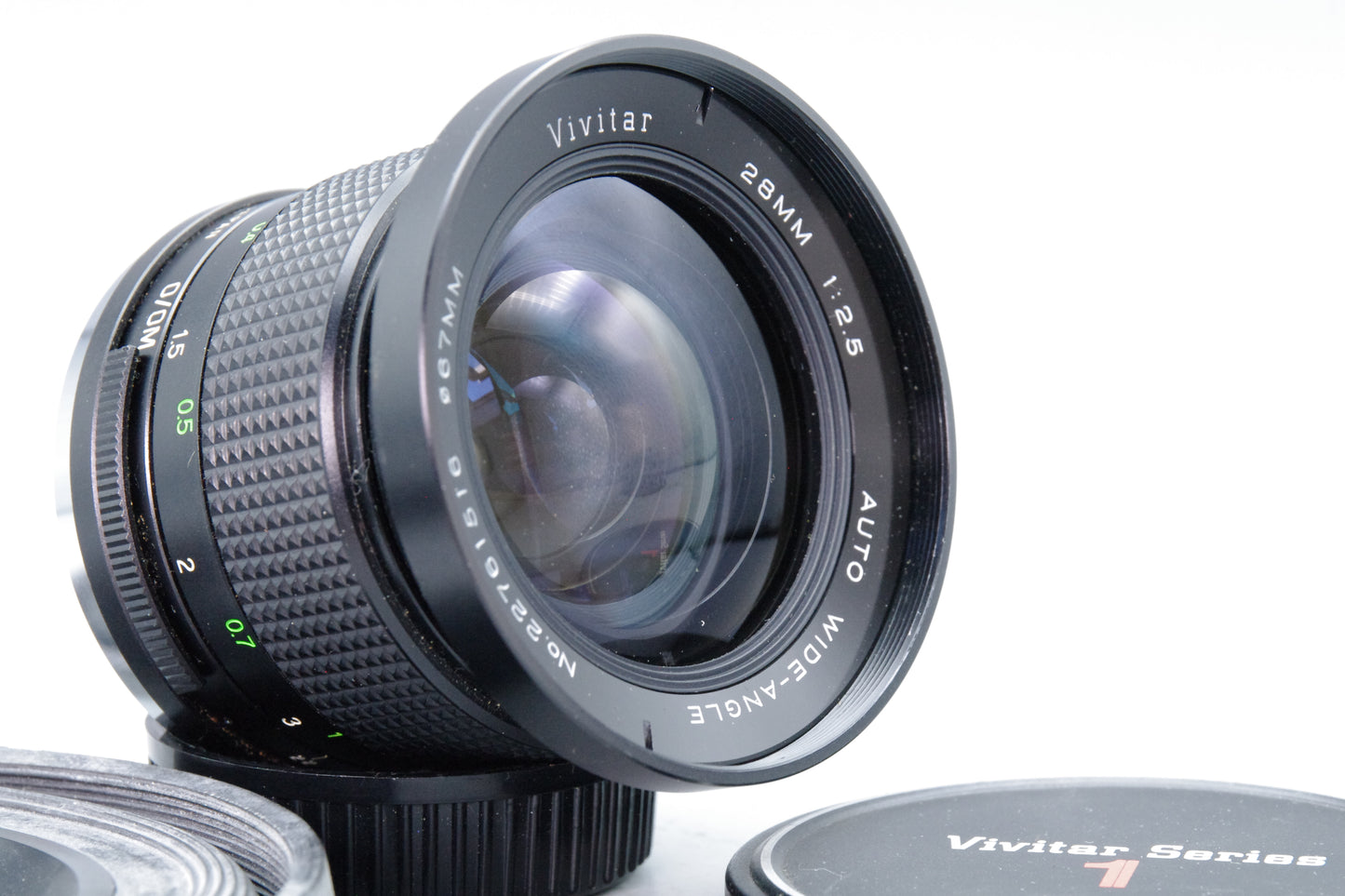 Vivitar 28mm f/2.5 Wide Angle Lens – OM Mount – Very Good – Caps & Hoya Hood