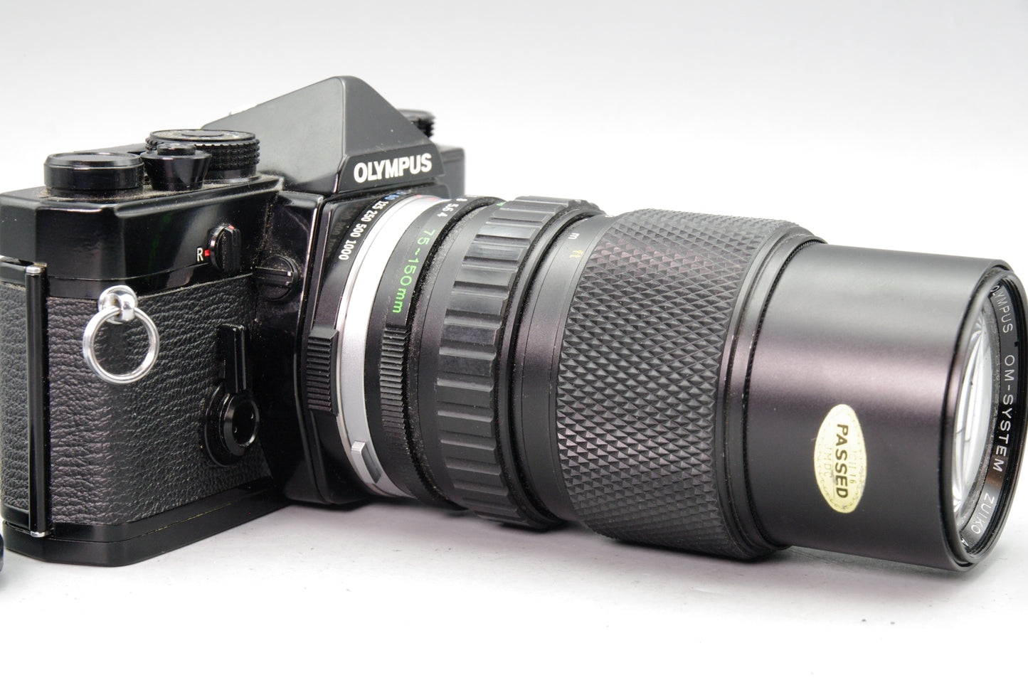 Black Olympus OM‑1 35mm SLR + Zuiko 75–150mm Lens- Tested and Working