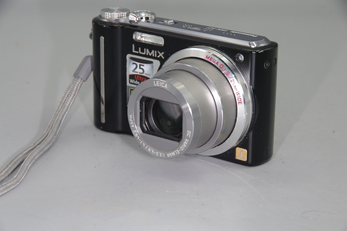 Panasonic Lumix DMC-TZ7 Digital Camera – Works but Marks in Lens