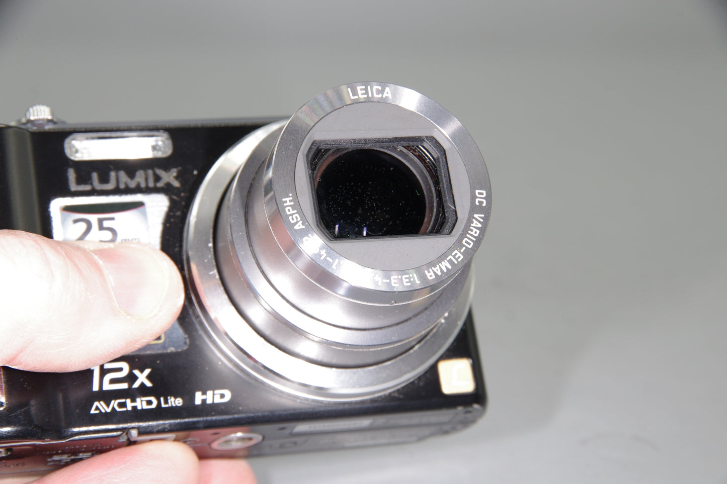Panasonic Lumix DMC-TZ7 Digital Camera – Works but Marks in Lens