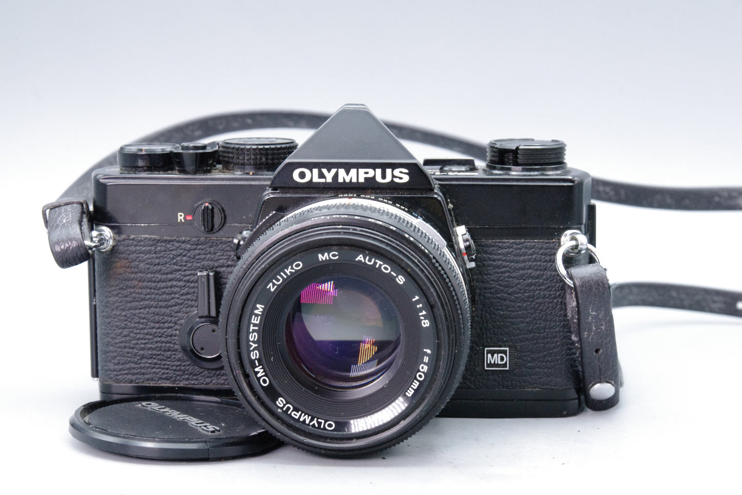 Olympus OM‑1N Black 35mm SLR Film Camera with Zuiko 50mm f/1.8 Lens – Excellent