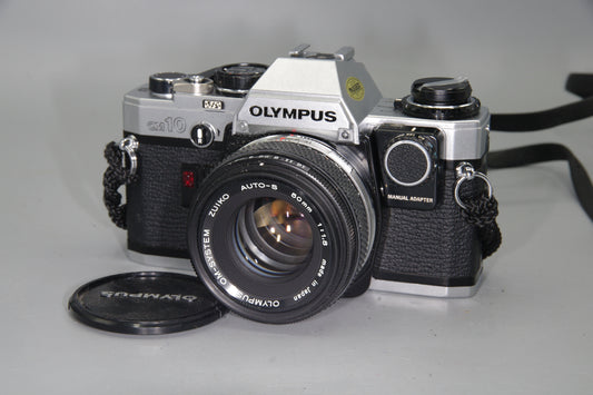 Olympus OM10 35mm SLR Camera + 50mm F/1.8 Lens + Manual Adapter + Batteries - VGC