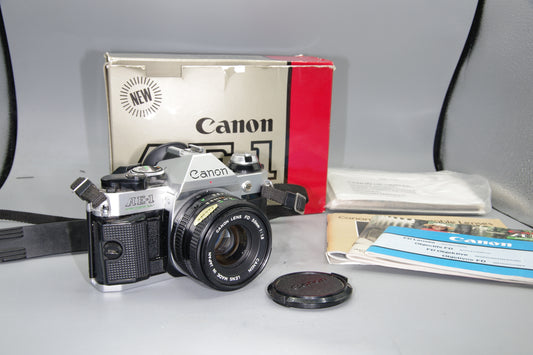Canon AE-1 Program + FD 50mm f/1.8 Lens  Boxed with Paperwork – Tested