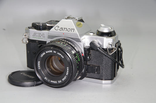 Canon AE‑1 Program 35mm SLR + FD 50mm f/1.8 Lens + Data Back A