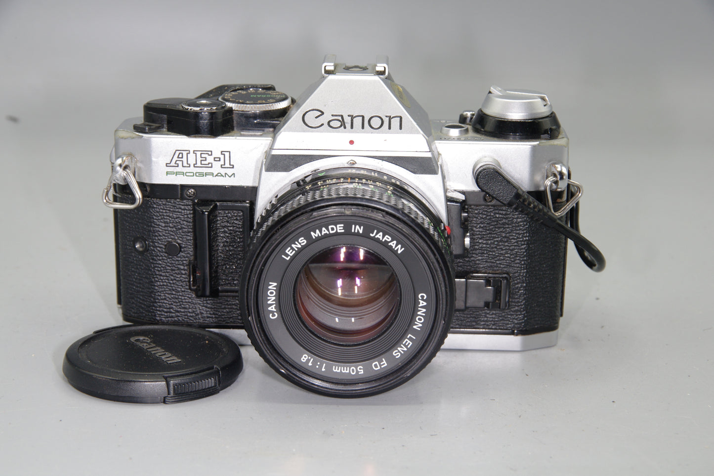 Canon AE‑1 Program 35mm SLR + FD 50mm f/1.8 Lens + Data Back A