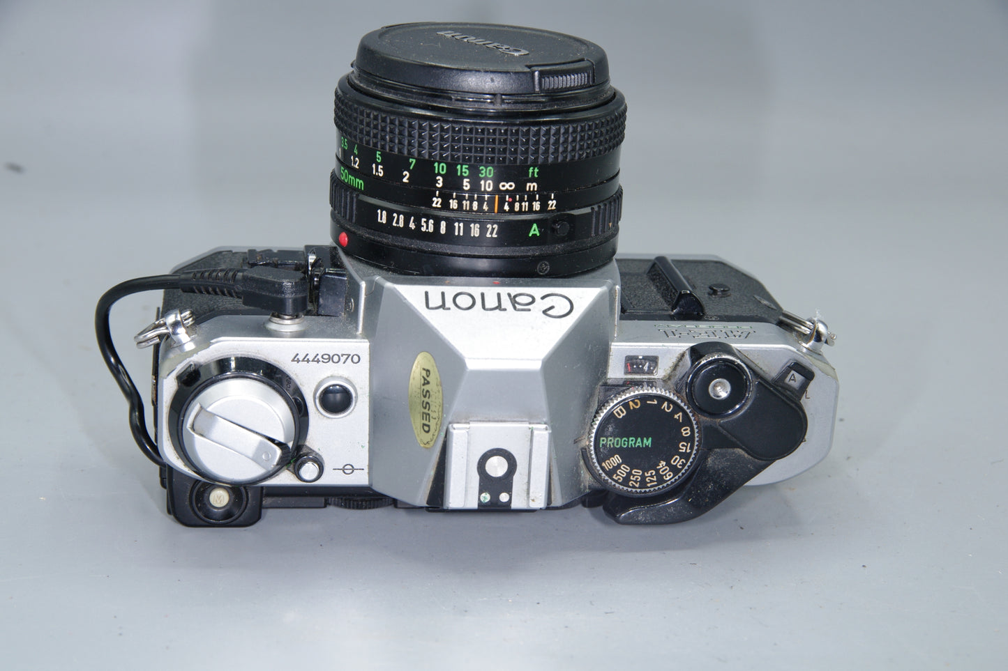 Canon AE‑1 Program 35mm SLR + FD 50mm f/1.8 Lens + Data Back A
