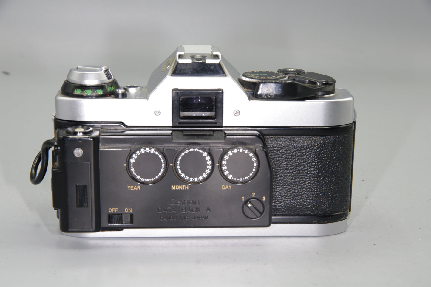 Canon AE‑1 Program 35mm SLR + FD 50mm f/1.8 Lens + Data Back A
