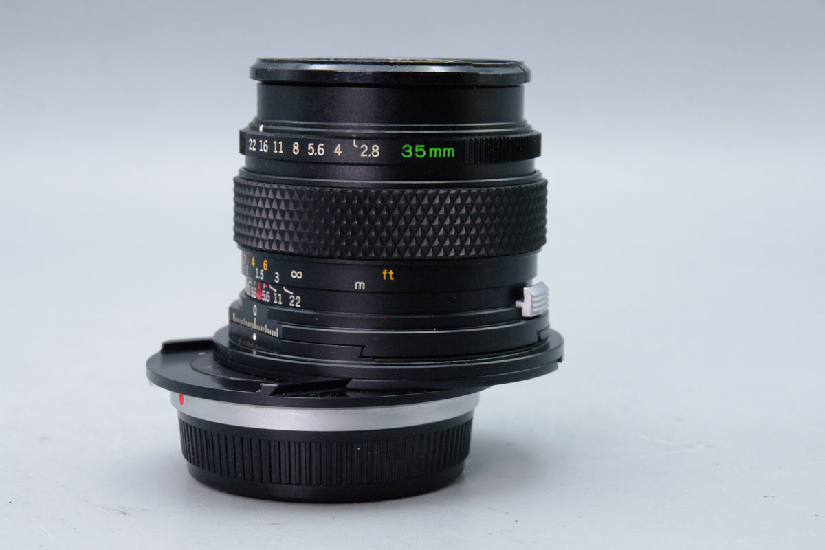 Olympus Zuiko Shift 35mm f/2.8 Lens – OM Mount – Excellent – With Both Caps
