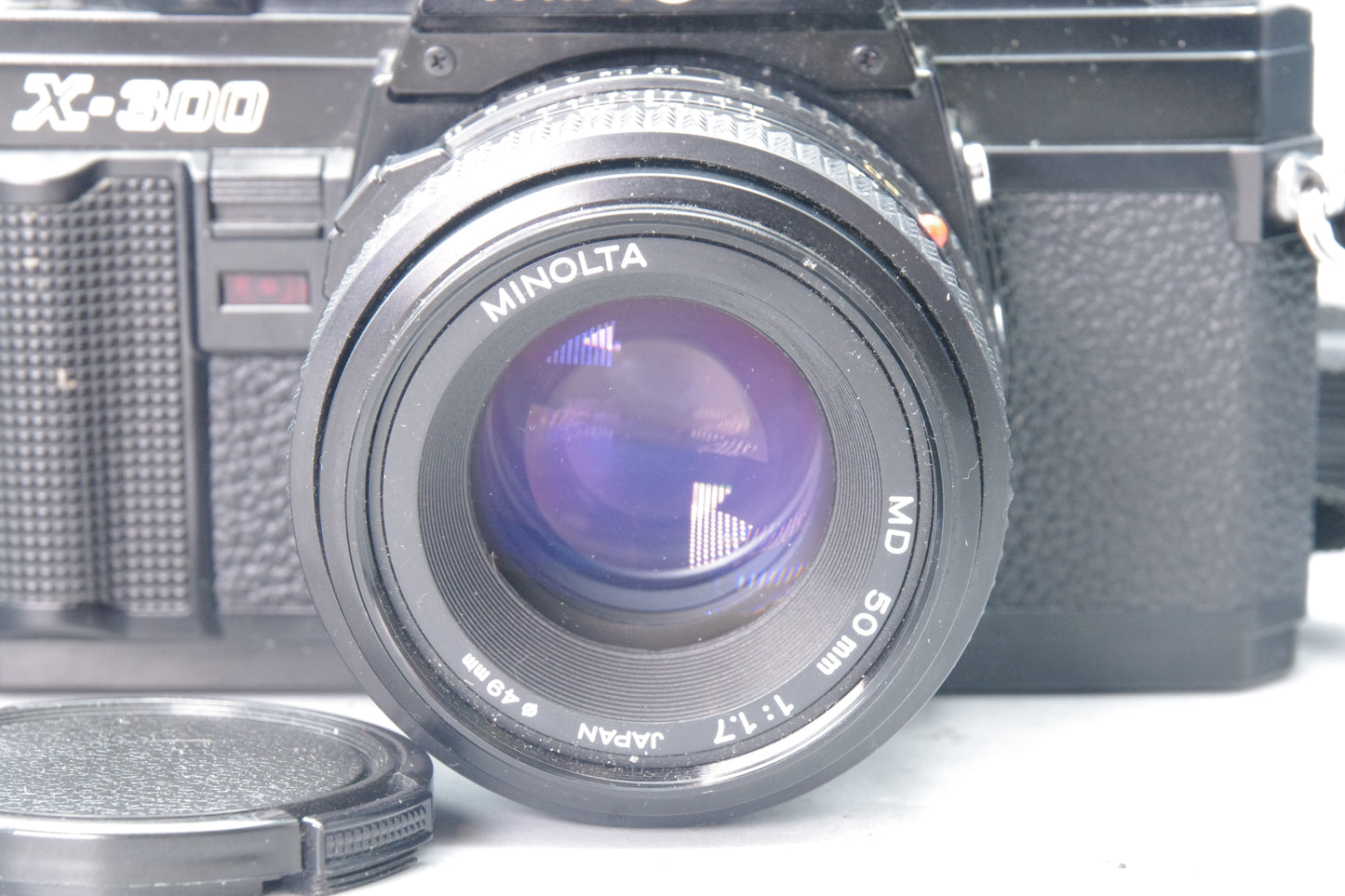 Minolta X‑300 35mm SLR with MD 50mm f/1.7 Lens – Excellent – Black