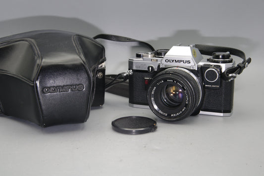 Olympus OM10 35mm SLR Camera + 50mm F/1.8 Lens + Manual Adapter + Batteries